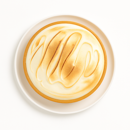 A lemon meringue pie viewed from above, showing smooth, swirled golden-brown meringue topping on a golden crust, placed on a white plate against a bright white background.