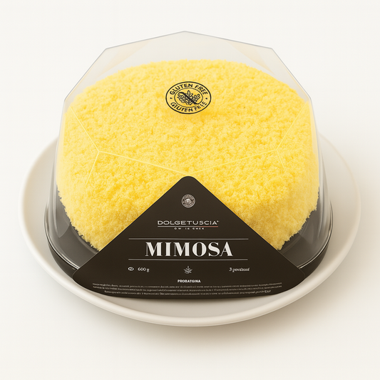 A yellow Mimosa cake in clear plastic packaging with a black label reading “Mimosa” and “Gluten Free,” sitting on a white plate against a white background.